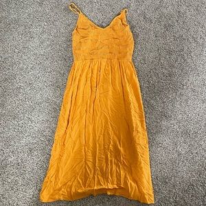 Large mustard dress.